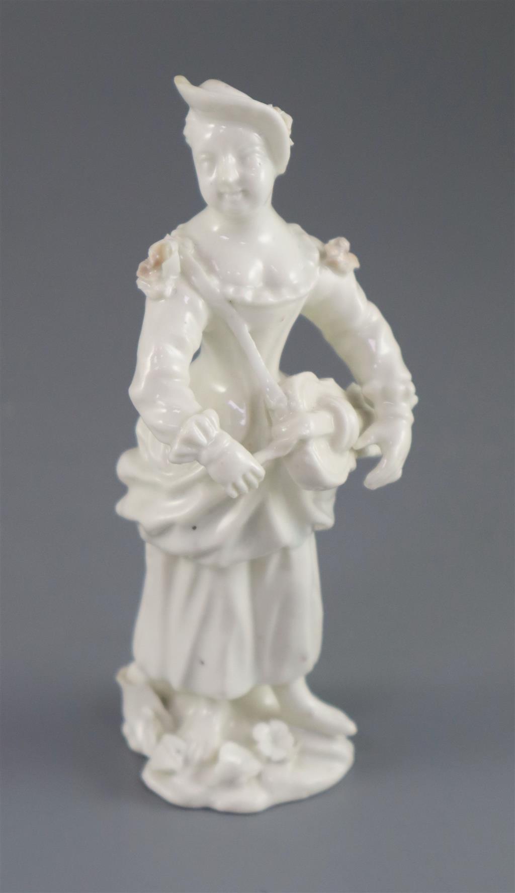 A rare French porcelain figure of a lady playing the Hurdy Gurdy, probably Orleans, c.1756-58, 13cm high